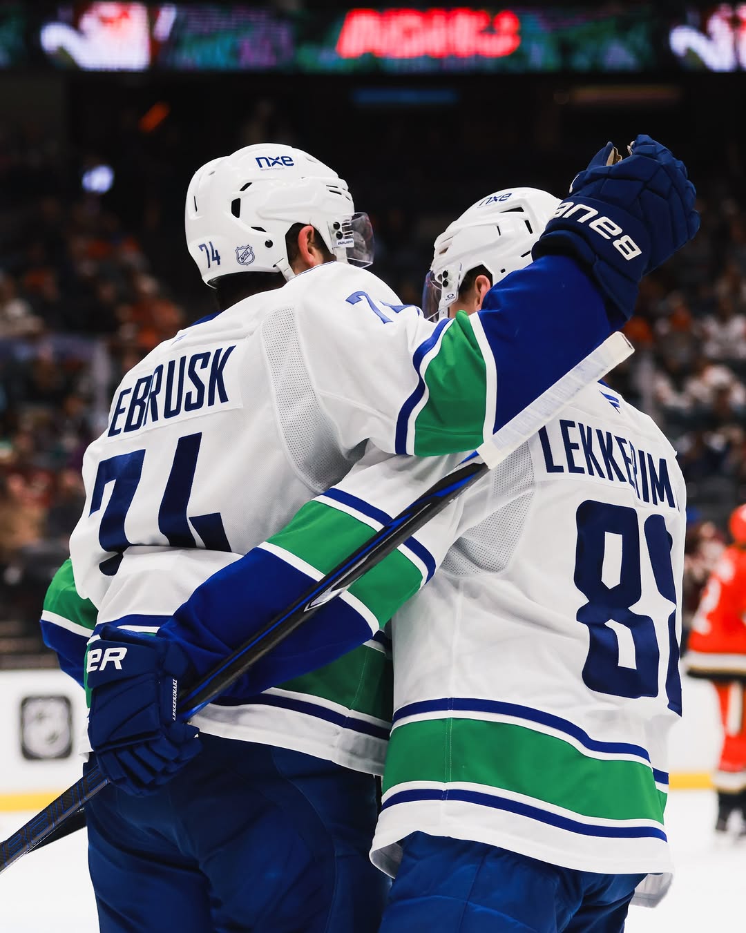 Jonathan Lekkerimaki, right, celebrates with Jake DeBrusk in Anaheim. Lekkerimaki scored twice in the final three minutes of regulation to drag Vancouver level from 5-3 down.