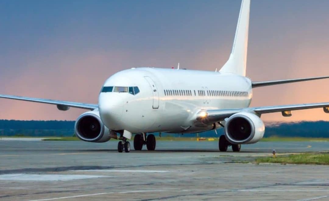 An airliner on a runway at dusk. Jet fuel is one of the products at the centre of the refining surge: Chevron has been promoting technology that helps refineries squeeze up to 10 percent more jet fuel from existing equipment. File photo.