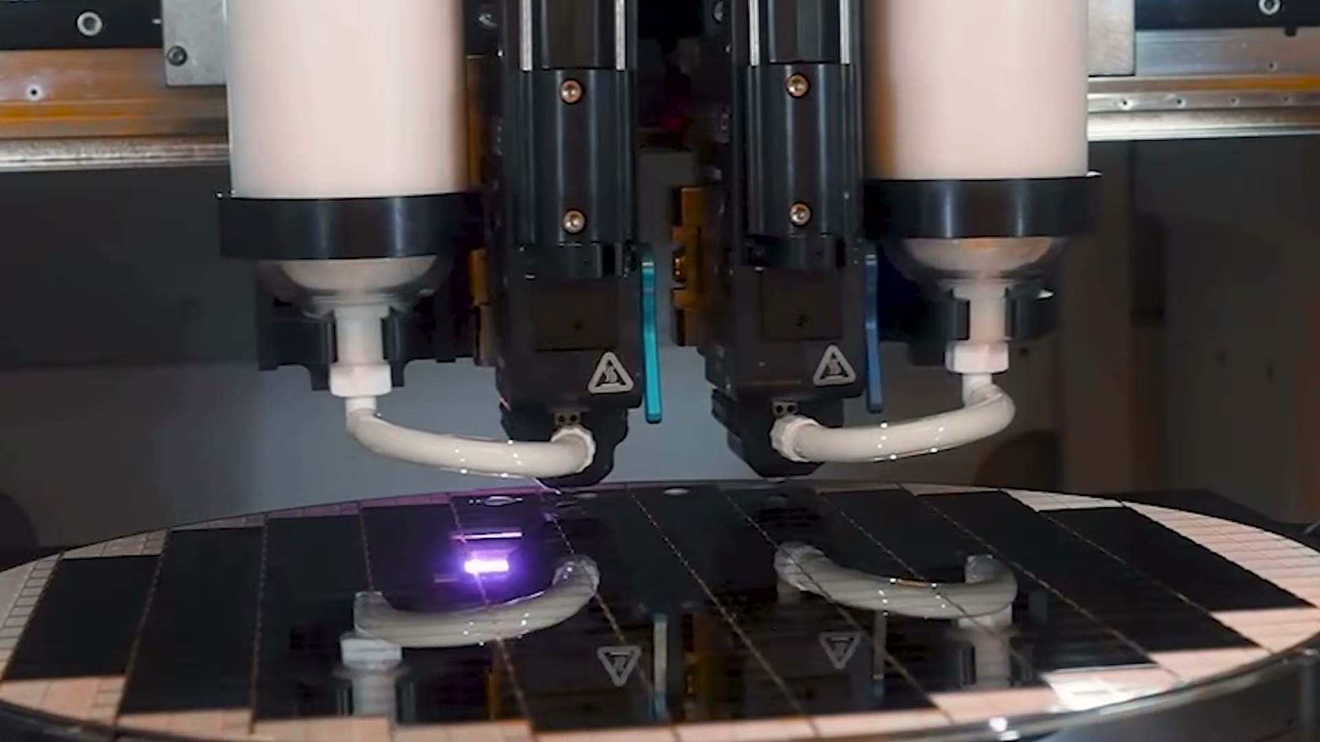 Advanced packaging machinery at work over a wafer in Intel's Foveros film from its New Mexico plant. The factories are not the problem in this story: the data centre business that fills them grew 78 percent in the quarter. Still from Intel footage, used as a file image.