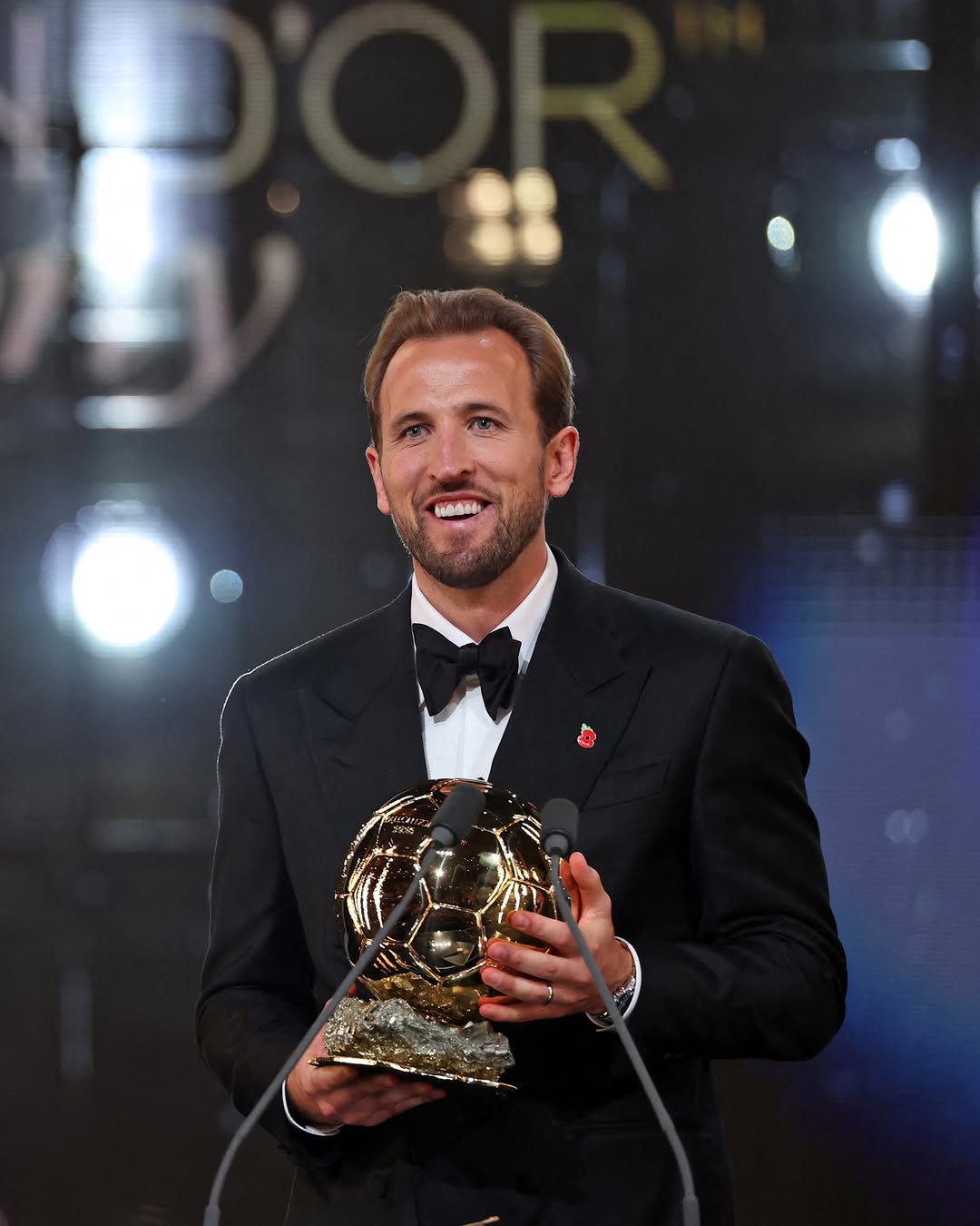 Harry Kane holds the Ballon d'Or trophy at the London Palladium on Monday night, after being named the best player in the world for 2026.