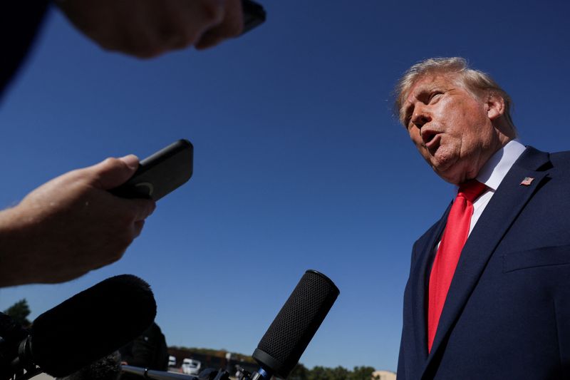 President Trump speaking to reporters, in the Reuters photograph carried with the wire report of Libya's protest.