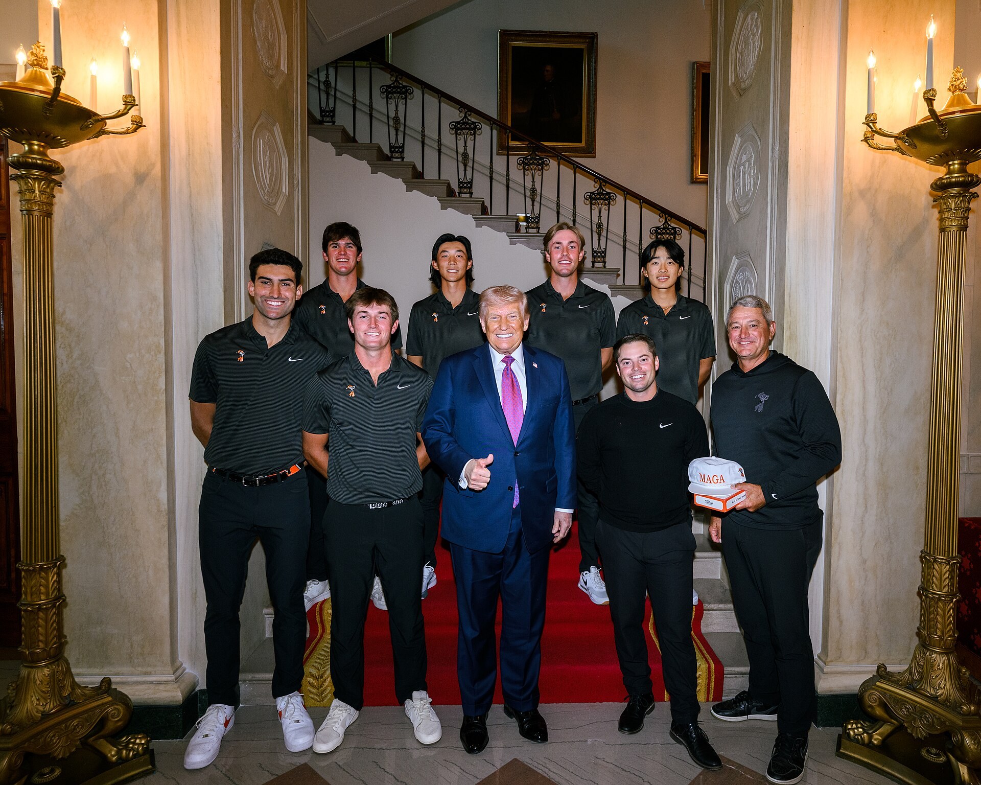 President Donald J. Trump poses with the Oklahoma State men’s golf team at the White House in April 2026.