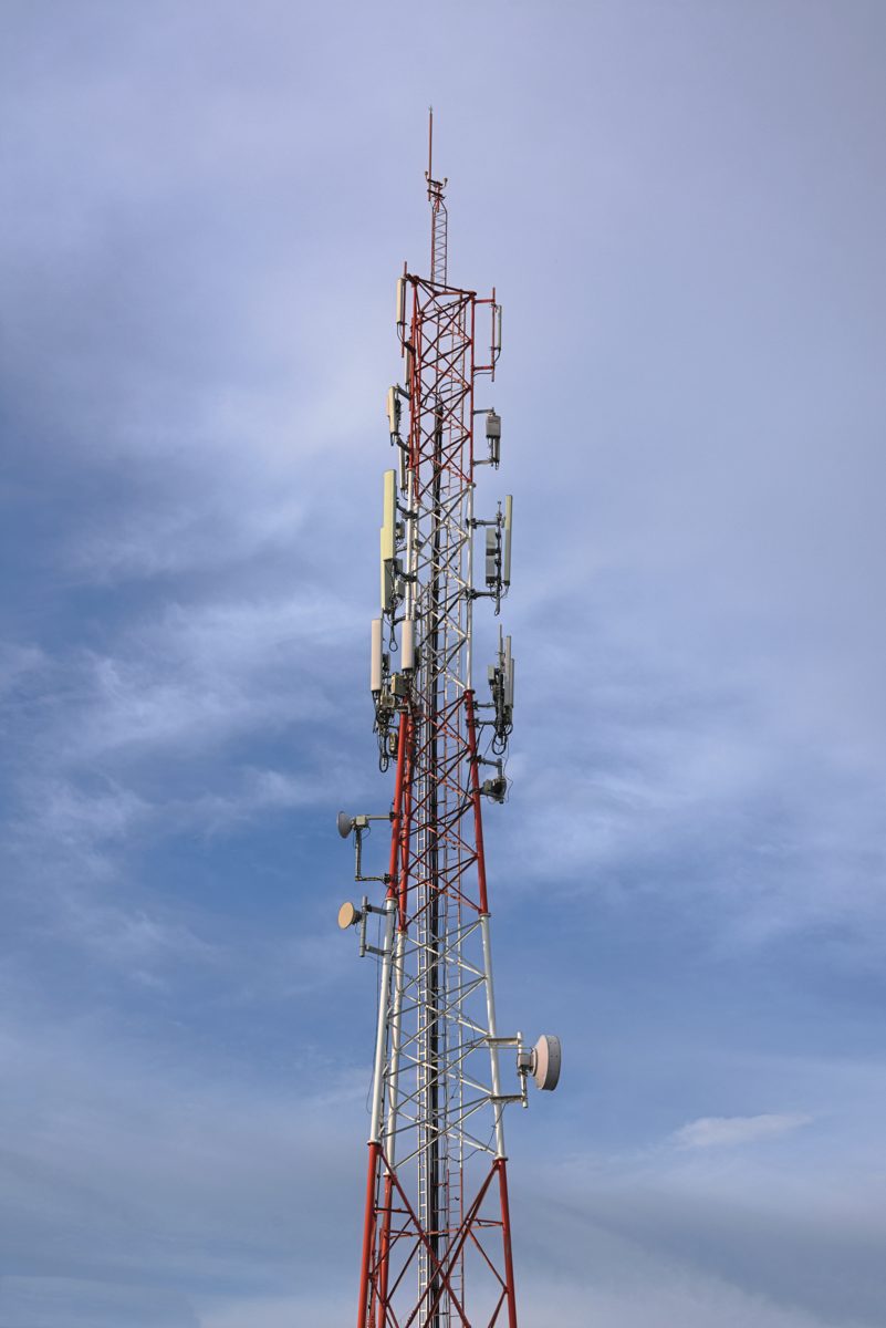 A multi-tenant cell tower carrying several antenna arrays. Tower owners such as Crown Castle rent space on structures like this to every carrier that needs it. File photo.